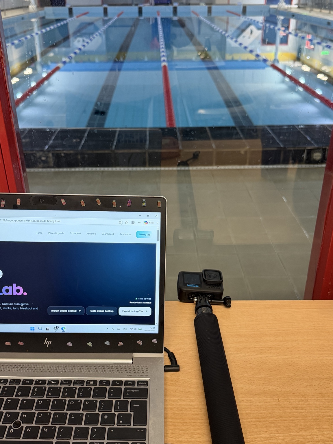 PB Performance Lab poolside timing setup with pool view