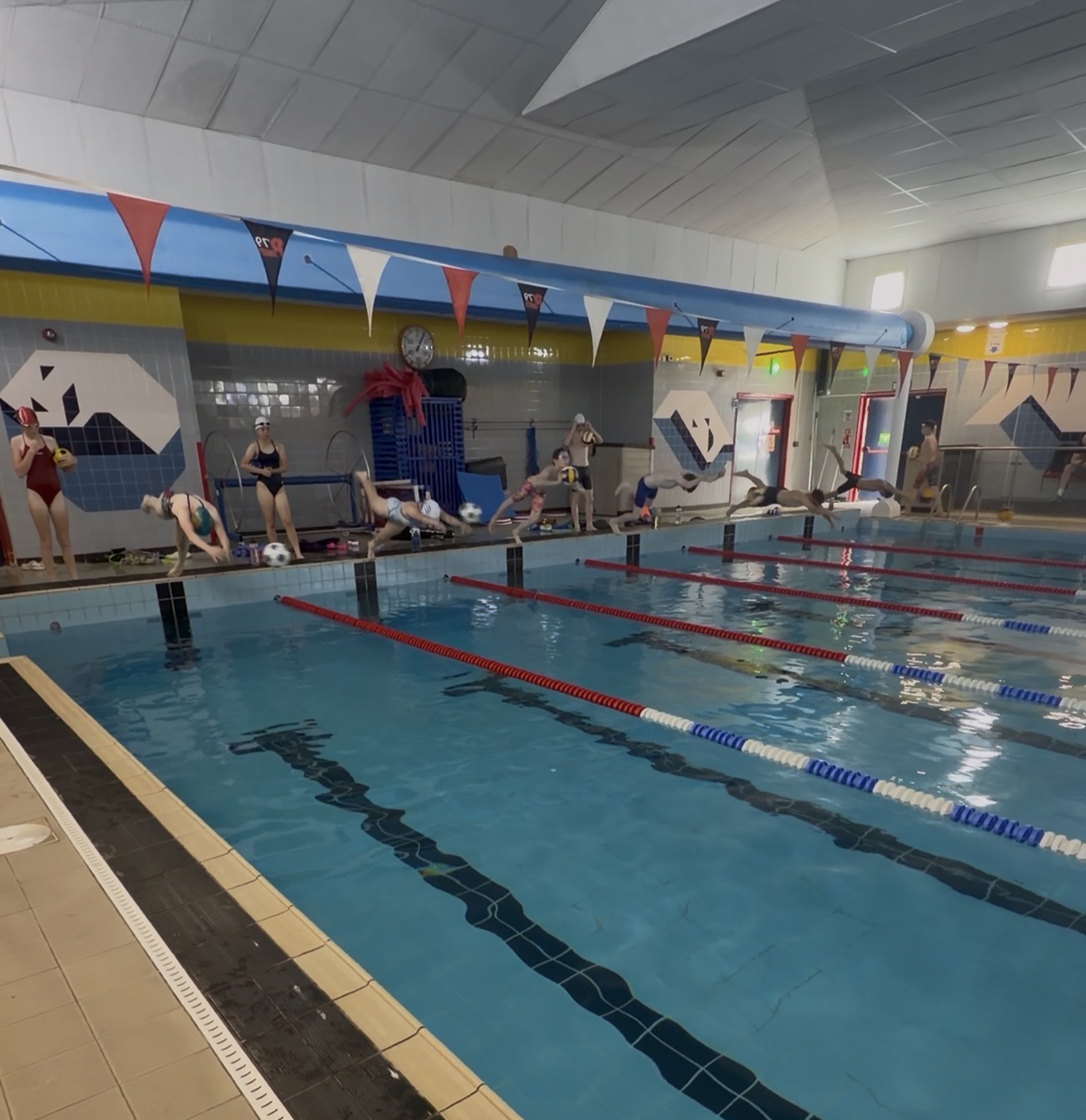 Swimmers practising race starts during PB Performance Lab